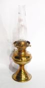 A Victorian brass and glass oil lamp having cut glass well on corinthian column base
