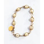 A gold-coloured metal and cultured pearl bracelet,