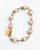 A gold-coloured metal and cultured pearl bracelet,