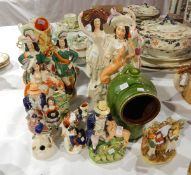 A collection of Staffordshire figures to include spill vases,