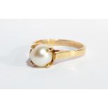 A 14K gold and pearl dress ring having claw set cultured pearl