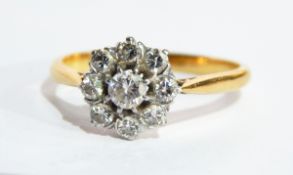 A 18ct gold and diamond cluster ring with flowerhead setting