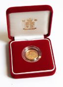 A 2004 gold proof half-sovereign,