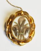 A Victorian gold oval locket pendant,