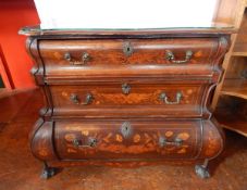 An 18th century Dutch bombe chest of three graduated drawers with floral and bird marquetry inlay