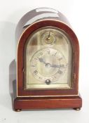 Early 20th century ivory inlaid mahogany mantel clock, the arched case with silvered dial,