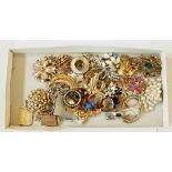 A quantity of costume jewellery, mainly brooches and clips including an enamel pony brooch, etc.