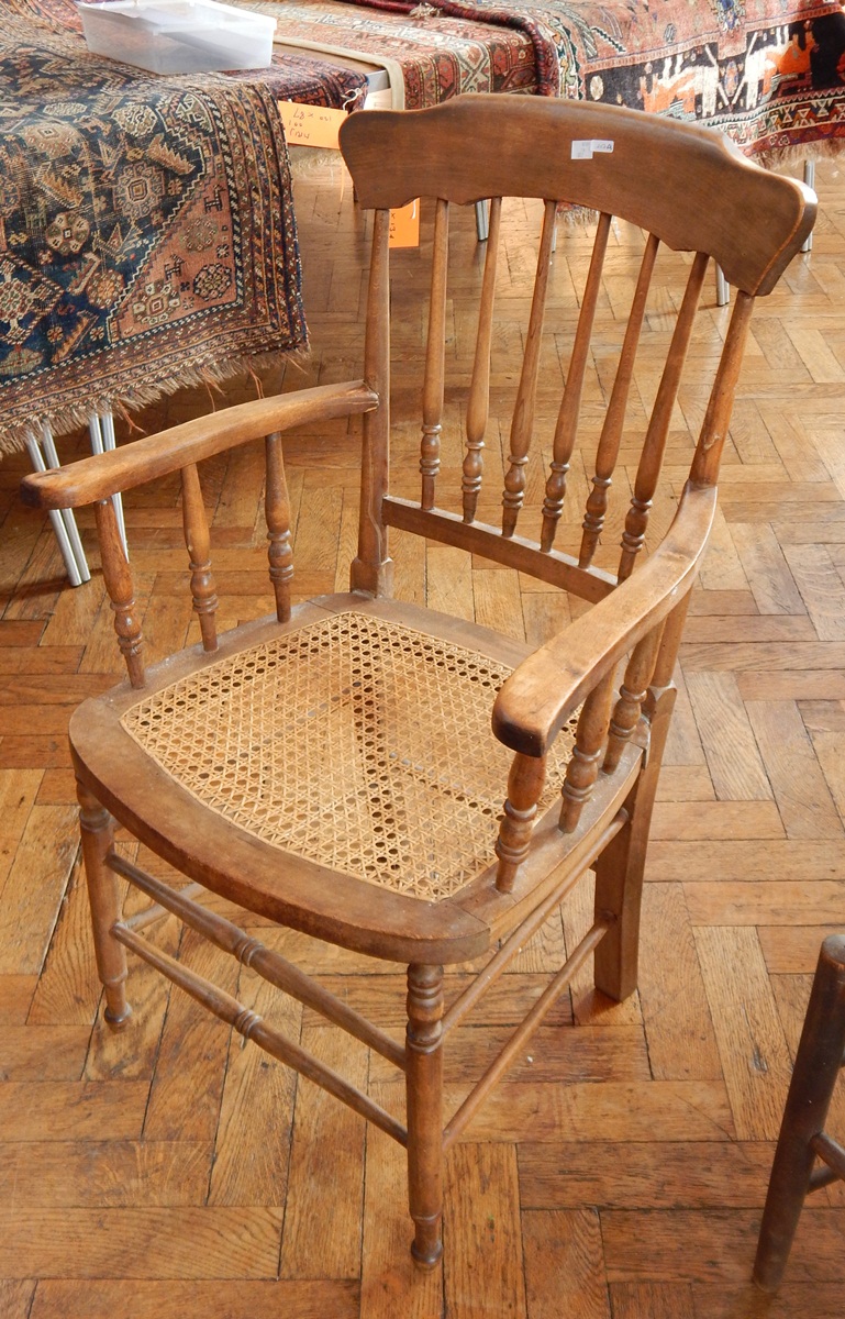 A Windsor spindle back chair with cane seat,
