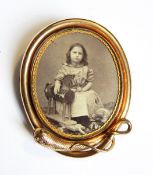 A Victorian oval locket brooch pendant,