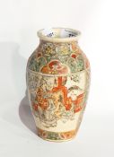A Japanese Satsuma earthenware vase, ovoid with figures in panels, in typical colours,