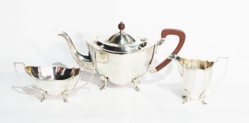 A silver three-piece teaset by Barker Brothers Silver Limited, Birmingham 1931 of shaped oval form,
