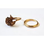 A 9ct gold ring modelled as a rosebud with leaves and a 9ct gold wedding band, 7.2g approx.