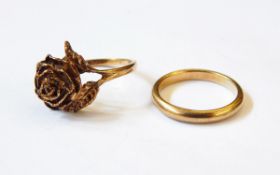A 9ct gold ring modelled as a rosebud with leaves and a 9ct gold wedding band, 7.2g approx.