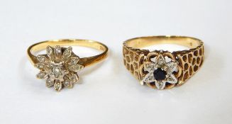 An 18ct gold and diamond flowerhead cluster ring having central diamond in white gold rubover