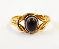 A gold ring set with onyx,