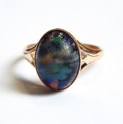 A gold and cabochon multi-coloured paste ring marked 9ct