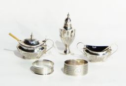 An Edwardian silver three-piece condiment set by CT Burrows & Sons,