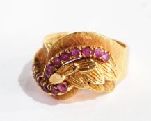 A 1960's 18ct gold and ruby dress ring, the twist setting with matt finish,