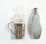 A George V silver scent bottle of oval form with engine-turned decoration, with dropper,