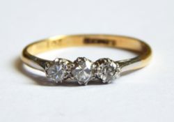 A three-stone diamond ring,
