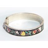 A sterling silver and enamel bangle,