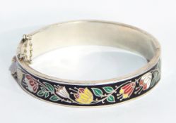 A sterling silver and enamel bangle,