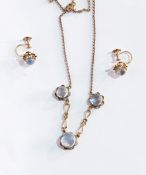 A gold-coloured metal and moonstone set necklace having three circular cabochon moonstones with