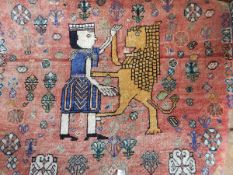 Eastern wool rug with central figural design of man and lion surrounded by foliate motifs of