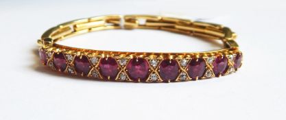 An Edwardian gold, ruby and diamond bracelet,