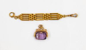A 9ct gold and amethyst swivel fob on a gate-link section