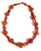 An amber bead necklace consisting of faceted amber beads with further amber spacers in between
