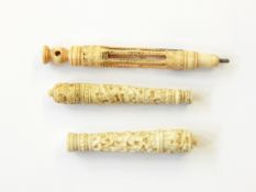 Three Victorian carved ivory needle cases