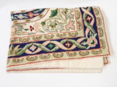 An embroidered woollen chain-stitch wall hanging, two tapestry tie-backs, a satin coverlet,