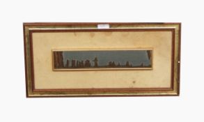 Framed hardstone panel of fossilised remains in landscape,