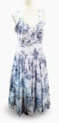 A 1950's style toile de jouy sundress in blue printed on white