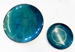 Two enamelled aluminium shallow dishes with teal feathered design,