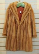 A vintage mink coat with bell sleeves,