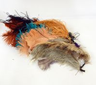 A large collection of feathers, hats, belts,