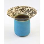 Stoneware vase with brown geometric patterned flared rim with powder blue body, marked "AR",