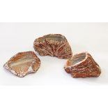 A collection of three studio pottery vessels of metamorphic forms,
