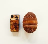 A wooden carved walnut thimble case and a faux-tortoiseshell needlecase (2)