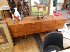 Canadian hardwood sideboard by Concord, with three short tapering drawers and three cupboards,