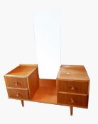 A modern teak/oak mirror back dressing chest of four short drawers,