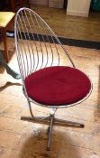 20th century stainless steel stickback chair with circular seat, red cushion, on U-shaped supports,