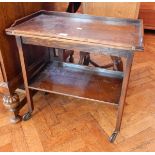 An oak folding top tea trolley with undershelf,