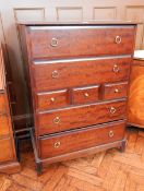 A Stag furniture chest of three short and four long drawers, raised on bracket feet,