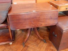 Early nineteenth century mahogany drop flap pedestal table with frieze drawer,