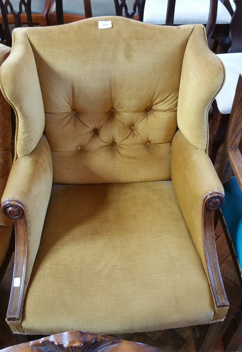 A 19th century wingside armchair with mahogany shewwood arms