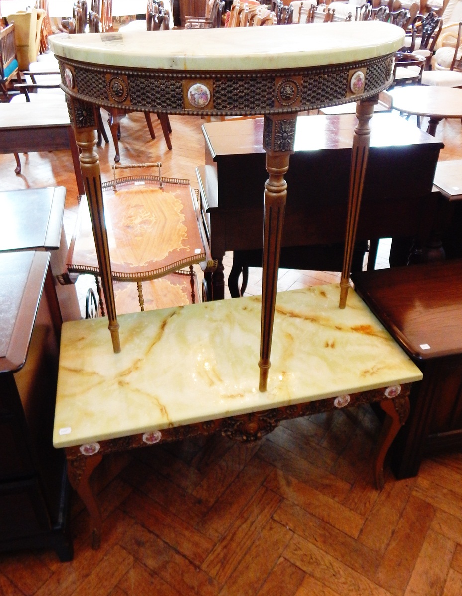 A Louis XVI style demi-lune side table with green onyx marbled top, frieze with porcelain plaques,