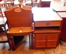 A Parker Knoll teak nest of three side tables, the cupboard with frieze drawer,
